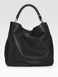 Rich leather design with a shoulder strap and subtle logo detail. Shoulder strap, 9 drop Magnetic snap closure One inside zip pocket Two inside open pockets Silk lining 15W X 13H X 6D Made in Italy Rich leather design with a shoulder strap and subtle logo detail. Shoulder strap, 9 drop Magnetic snap closure One inside zip pocket Two inside open pockets Silk lining 15W X 13H X 6D Made in Italy
