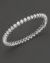 Classic elegance, a diamond bezel tennis bracelet in white gold. Classic elegance, a diamond bezel tennis bracelet in white gold.