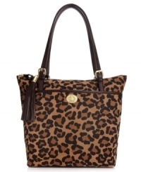 Get spotted wearing something wild with this spacious leopard print tote from Tommy Hilfiger. Sumptuous suede is accented with custom hardware, flirty tassel and signature stripe, making it the perfect marriage of preppy and posh. Get spotted wearing something wild with this spacious leopard print tote from Tommy Hilfiger. Sumptuous suede is accented with custom hardware, flirty tassel and signature stripe, making it the perfect marriage of preppy and posh.