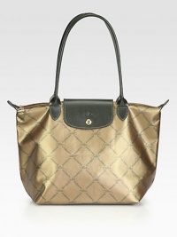 An iridescent canvas style with signature logo print and leather accents, perfect for travel or everyday.Double leather top handles, 4½ dropTop zip closure with snap button flapOne inside open pocketCotton lining9¾W X 9¾H X 5½DImported An iridescent canvas style with signature logo print and leather accents, perfect for travel or everyday.Double leather top handles, 4½ dropTop zip closure with snap button flapOne inside open pocketCotton lining9¾W X 9¾H X 5½DImported