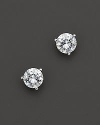 Three prong diamond stud earrings in a platinum martini setting. Three prong diamond stud earrings in a platinum martini setting.
