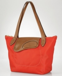 Perfect for Saturday morning errands or an afternoon by the beach, this versatile tote from Lauren by Ralf Lauren takes you there in style. The lustrous, durable nylon is complemented with equestrian inspired details that lend an elegant heritage look to any ensemble. Perfect for Saturday morning errands or an afternoon by the beach, this versatile tote from Lauren by Ralf Lauren takes you there in style. The lustrous, durable nylon is complemented with equestrian inspired details that lend an elegant heritage look to any ensemble.