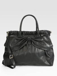 A supple leather style with an iconic bow accent and sweet romantic flair.Double top handles, 7 dropDetachable adjustable shoulder strap, 21-23 dropMagnetic snap closureOne inside zip pocketTwo inside open pocketsCotton lining14W X 9H X 2DMade in Italy A supple leather style with an iconic bow accent and sweet romantic flair.Double top handles, 7 dropDetachable adjustable shoulder strap, 21-23 dropMagnetic snap closureOne inside zip pocketTwo inside open pocketsCotton lining14W X 9H X 2DMade in Italy