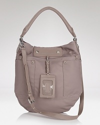 MARC BY MARC JACOBS' leather hobo take its cues from school-yard chic. The durable nylon bag touts essentials (or books,) making it a perfect partner for your day-to-day uniform. MARC BY MARC JACOBS' leather hobo take its cues from school-yard chic. The durable nylon bag touts essentials (or books,) making it a perfect partner for your day-to-day uniform.