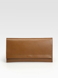 A sleek envelope bag crafted from rich, butter-smooth leather with a contrast exterior pocket on the back.Flap snap closureContrast flat card holder slips into back pocket9½W X 6H X 1½DMade in Italy