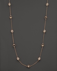 Clear rock crystal rests inside 18K rose gold stations on this modern Di MODOLO necklace. Clear rock crystal rests inside 18K rose gold stations on this modern Di MODOLO necklace.