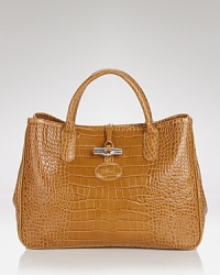 Longchamp's croc embossed leather tote exudes poise, boasting top handles and a structured silhouette. In exotic style, this bag is ready to meet daytime demands. Longchamp's croc embossed leather tote exudes poise, boasting top handles and a structured silhouette. In exotic style, this bag is ready to meet daytime demands.