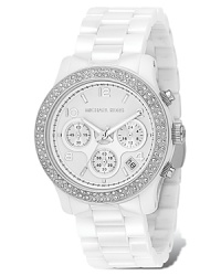 Michael Kors chronograph bracelet watch in white ceramic and stainless steel has a glammed up clear stone bezel. White dial with date display and second hand. Michael Kors chronograph bracelet watch in white ceramic and stainless steel has a glammed up clear stone bezel. White dial with date display and second hand.