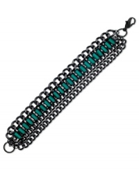 Emerald city sophistication. This GUESS bracelet displays baguette-cut emerald crystals on a trendy four-row design. Crafted in hematite tone mixed metal. Approximate length: 7-1/2 inches. Emerald city sophistication. This GUESS bracelet displays baguette-cut emerald crystals on a trendy four-row design. Crafted in hematite tone mixed metal. Approximate length: 7-1/2 inches.