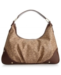 Great style starts with a classic silhouette and this fab take-anywhere hobo from Calvin Klein is the perfect choice. Signature print, supple leather trim and golden stud detailing adorn the design, while the roomy interior is aligned with plenty of pockets for your everyday essentials. Great style starts with a classic silhouette and this fab take-anywhere hobo from Calvin Klein is the perfect choice. Signature print, supple leather trim and golden stud detailing adorn the design, while the roomy interior is aligned with plenty of pockets for your everyday essentials.