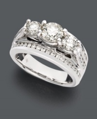 Take her breath away with stunning diamonds and unique design. This sparkling wedding ring features a three stone diamond design lined with channel-set diamonds (2 ct. t.w.). Crafted in 14k white gold. Take her breath away with stunning diamonds and unique design. This sparkling wedding ring features a three stone diamond design lined with channel-set diamonds (2 ct. t.w.). Crafted in 14k white gold.
