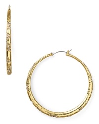 Nail this season's statement earring trend with pair of hoops from ABS by Allen Schwartz, accented by scattered pave crystals. Nail this season's statement earring trend with pair of hoops from ABS by Allen Schwartz, accented by scattered pave crystals.