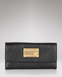 A chic leather trifold wallet from MARC BY MARC JACOBS. A chic leather trifold wallet from MARC BY MARC JACOBS.
