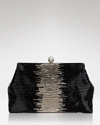 A smattering of iridescent beads lend a textured appeal to the slim and structured silhouette of this Badgley Mischka clutch, which is secured by a top snap closure. A smattering of iridescent beads lend a textured appeal to the slim and structured silhouette of this Badgley Mischka clutch, which is secured by a top snap closure.
