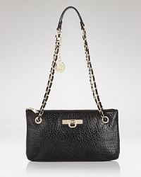 High shine hardware gives this sleek convertible bag from DKNY a hit of cool. Style it over the shoulder or tuck it under your arm to tap this bag's versatile appeal. High shine hardware gives this sleek convertible bag from DKNY a hit of cool. Style it over the shoulder or tuck it under your arm to tap this bag's versatile appeal.