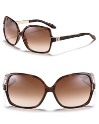 Sunglasses with a wild side. Roberto Cavalli's square oversized frames features signature logo detail at temples and crocodile inlaid arms. Sunglasses with a wild side. Roberto Cavalli's square oversized frames features signature logo detail at temples and crocodile inlaid arms.
