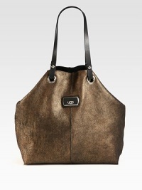 This ultra-soft and luxurious metallic shearling style is accented with leather details.Double leather shoulder straps, 9½ dropCenter snap button strap closure14W X 14H X 5½DImported This ultra-soft and luxurious metallic shearling style is accented with leather details.Double leather shoulder straps, 9½ dropCenter snap button strap closure14W X 14H X 5½DImported