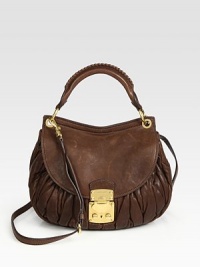 Ruched lambskin style finished polished goldtone hardware.Top handle, 5 dropDetachable adjustable shoulder strap, 24¼-26½ dropFlap-and-clasp coffer closureMetal letter logo detailOne outside zip pocketOne inside zip pocketOne inside open pocketCotton/satin lining11W X 9¾H X 3DMade in Italy Ruched lambskin style finished polished goldtone hardware.Top handle, 5 dropDetachable adjustable shoulder strap, 24¼-26½ dropFlap-and-clasp coffer closureMetal letter logo detailOne outside zip pocketOne inside zip pocketOne inside open pocketCotton/satin lining11W X 9¾H X 3DMade in Italy