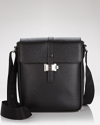 Crafted from black northern Italian leather with a subtle print and a fine rare finish, this business-stylish bag is lean yet loaded with a PDA pocket, a pen pocket and a medium-sized document flap pocket. Crafted from black northern Italian leather with a subtle print and a fine rare finish, this business-stylish bag is lean yet loaded with a PDA pocket, a pen pocket and a medium-sized document flap pocket.