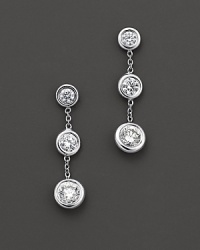 White gold bezel-set diamond earrings in three-stone linear design. With signature ruby accent. Designed by Roberto Coin. White gold bezel-set diamond earrings in three-stone linear design. With signature ruby accent. Designed by Roberto Coin.