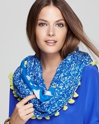 Bright pom poms bring a fun finish to DIANE von FURSTENBERG's vacation-perfect infinity scarf, boasting double-sided prints. Bright pom poms bring a fun finish to DIANE von FURSTENBERG's vacation-perfect infinity scarf, boasting double-sided prints.