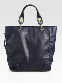 Butter-smooth calfskin in an oversized top handle carryall.Double top handles, 6½ dropTop hook closureProtective metal feetOne inside zip pocketOne inside open pocketCotton lining12¾W X 14¼H X 6½DImported Butter-smooth calfskin in an oversized top handle carryall.Double top handles, 6½ dropTop hook closureProtective metal feetOne inside zip pocketOne inside open pocketCotton lining12¾W X 14¼H X 6½DImported