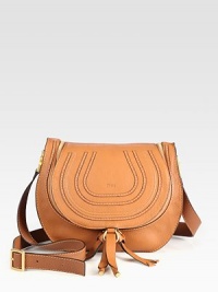 This luxurious leather design features a unique zip-flap closure with a comfortable crossbody strap.Adjustable crossbody strap, 21-25 dropTop-zip flap closureOne inside zip pocketCotton lining12W X 10H X 4½DMade in Italy This luxurious leather design features a unique zip-flap closure with a comfortable crossbody strap.Adjustable crossbody strap, 21-25 dropTop-zip flap closureOne inside zip pocketCotton lining12W X 10H X 4½DMade in Italy