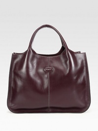 A well-crafted, smooth leather style with contrast topstitching in a roomy top handle design.Double top handles, 6½ dropDetachable shoulder strap, 22 dropMagnetic snap closureOne inside zip pocketTwo inside open pocketsSatin lining16W X 11½H X 4¾DImported A well-crafted, smooth leather style with contrast topstitching in a roomy top handle design.Double top handles, 6½ dropDetachable shoulder strap, 22 dropMagnetic snap closureOne inside zip pocketTwo inside open pocketsSatin lining16W X 11½H X 4¾DImported