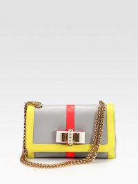 A chic colorblocked style in patent and smooth leather with a sweet bow detail, gold tone hardware and signature red lining.Chain shoulder strap, 12 dropPush-lock flap closureOne open pocket under flapOne inside zip pocketOne inside open pocketSignature red lining10W X 6¼H X 2¾DMade in Italy A chic colorblocked style in patent and smooth leather with a sweet bow detail, gold tone hardware and signature red lining.Chain shoulder strap, 12 dropPush-lock flap closureOne open pocket under flapOne inside zip pocketOne inside open pocketSignature red lining10W X 6¼H X 2¾DMade in Italy