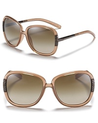Burberry's signature look is subtly stated with check patterned temples along a glamorous oversize frame. Burberry's signature look is subtly stated with check patterned temples along a glamorous oversize frame.