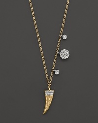 A diamond-embellished horn pendant necklace in yellow gold from Meira T. A diamond-embellished horn pendant necklace in yellow gold from Meira T.