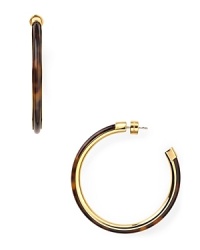 Plated in high-shine metal and detailed with retro-chic tortoiseshell, these Michael Kors earrings style every look with effortless, heritage-inspired luxury. Plated in high-shine metal and detailed with retro-chic tortoiseshell, these Michael Kors earrings style every look with effortless, heritage-inspired luxury.