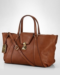 A bag to covet now and carry forever, this Lauren Ralph Lauren tote encapsulates season-to-season chic, crafted of rich leather with classic buckle detailing. A bag to covet now and carry forever, this Lauren Ralph Lauren tote encapsulates season-to-season chic, crafted of rich leather with classic buckle detailing.