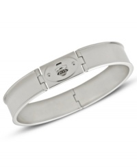 A classic bangle bracelet from Fossil with an iconic turnlock closure. Includes hinges. Crafted in polished stainless steel. Approximate diameter: 2 5/8 inch.