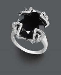 Not for the shy, this bold style makes a spectacular statement! Crafted in sterling silver, a large onyx center stone (12-1/3 ct. t.w.) is the focal point against a diamond dusted (1/10 ct. t.w.) prong setting. Size 7. Not for the shy, this bold style makes a spectacular statement! Crafted in sterling silver, a large onyx center stone (12-1/3 ct. t.w.) is the focal point against a diamond dusted (1/10 ct. t.w.) prong setting. Size 7.