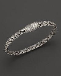 Diamonds glitter from the clasp of a sterling silver bracelet, part of the John Hardy Classic Chain Kepang collection. Diamonds glitter from the clasp of a sterling silver bracelet, part of the John Hardy Classic Chain Kepang collection.
