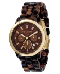 A timepiece with striking style by Michael Kors. A timepiece with striking style by Michael Kors.