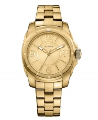 A shining example of luxe elegance, by Tommy Hilfiger. Watch crafted of gold tone stainless steel bracelet and round case. Gold tone dial features Arabic numerals at three, six, nine and twelve o'clock, stick indices, three hands and logo at twelve o'clock. Quartz movement. Water resistant to 30 meters. Ten-year limited warranty. A shining example of luxe elegance, by Tommy Hilfiger. Watch crafted of gold tone stainless steel bracelet and round case. Gold tone dial features Arabic numerals at three, six, nine and twelve o'clock, stick indices, three hands and logo at twelve o'clock. Quartz movement. Water resistant to 30 meters. Ten-year limited warranty.