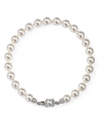 Simulated pearls set in rhodium-plated metal provide a luminous touch on this Nadri bracelet, laced with glistening cubic zirconia stones. Simulated pearls set in rhodium-plated metal provide a luminous touch on this Nadri bracelet, laced with glistening cubic zirconia stones.