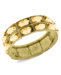 Golden goddess. 2028's stretch bracelet adds a regal touch with light topaz epoxy stones on a linked silhouette. Stretches to fit wrist. Crafted in gold tone mixed metal. Approximate diameter: 2-1/4 inches. Golden goddess. 2028's stretch bracelet adds a regal touch with light topaz epoxy stones on a linked silhouette. Stretches to fit wrist. Crafted in gold tone mixed metal. Approximate diameter: 2-1/4 inches.
