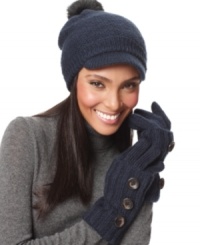 Snug as a bug and cute to boot! Warm your ears with this close-fitting knit cap by Nine West featuring a faux fur pom pom and short brim. Snug as a bug and cute to boot! Warm your ears with this close-fitting knit cap by Nine West featuring a faux fur pom pom and short brim.