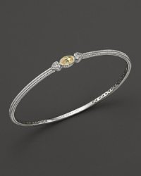 Two hearts flank a faceted canary crystal on this slim bangle with white sapphires. Two hearts flank a faceted canary crystal on this slim bangle with white sapphires.