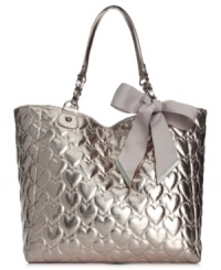 Let your look shine day and night with this shimmery metallic tote from Betsey Johnson. Spacious, pocked-lined and adorned with a sweet heart-embossed pattern topped off with a bow, it's truly scrumptious. Let your look shine day and night with this shimmery metallic tote from Betsey Johnson. Spacious, pocked-lined and adorned with a sweet heart-embossed pattern topped off with a bow, it's truly scrumptious.