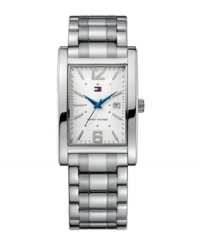 Even classics can use a modern punch. This handsome Tommy Hilfiger watch catches eyes with unexpected blue accents. Silvertone mixed metal bracelet and rectangular case. Textured dial features silvertone stick indices, numerals at twelve and six o'clock, date window at three o'clock, iconic flag logo and bright blue hands. Quartz movement. Water resistant to 30 meters. Ten-year limited warranty.