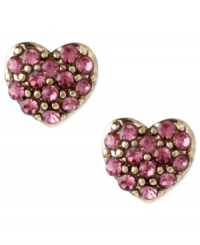 Turn on your heart light. Betsey Johnson's pretty-in-pink heart stud earrings are adorned with round-cut crystals. Crafted in antiqued gold tone mixed metal. Approximate diameter: 1/3 inch. Turn on your heart light. Betsey Johnson's pretty-in-pink heart stud earrings are adorned with round-cut crystals. Crafted in antiqued gold tone mixed metal. Approximate diameter: 1/3 inch.