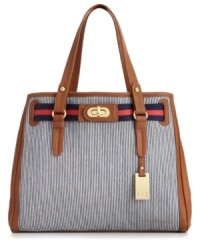 A preppy summer look from Tommy Hilfiger. This striped denim design will keep you stylish all season long with sleek contrast trim, signature gold-tone hardware and bold striped detail at top. A preppy summer look from Tommy Hilfiger. This striped denim design will keep you stylish all season long with sleek contrast trim, signature gold-tone hardware and bold striped detail at top.