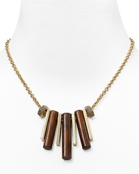 Give your look an on-trend hit of texture with this statement necklace from MARC BY MARC JACOBS. With wooden pipe charms, it's a natural way to enliven your neckline. Give your look an on-trend hit of texture with this statement necklace from MARC BY MARC JACOBS. With wooden pipe charms, it's a natural way to enliven your neckline.
