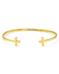 Channel a whisper of Gothic glamor with this gold plated Gorjana bangle, finished in a pair of subtly subversive crosses. Channel a whisper of Gothic glamor with this gold plated Gorjana bangle, finished in a pair of subtly subversive crosses.