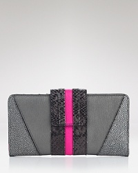Slim, stylish, and never subtle, a leather Juicy Couture snap-close wallet has room for your most glamorous day-to-day essentials. The interior has a zip pocket, ID holder and 13 card slots. Slim, stylish, and never subtle, a leather Juicy Couture snap-close wallet has room for your most glamorous day-to-day essentials. The interior has a zip pocket, ID holder and 13 card slots.