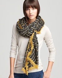 The perfect piece to wear with a military green jacket, this Burberry scarf is done up in a graphic, tweed print with a gold border. The perfect piece to wear with a military green jacket, this Burberry scarf is done up in a graphic, tweed print with a gold border.